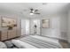 Spacious main bedroom featuring neutral decor, a ceiling fan, and ample closet space at 7216 Carlton Dr, Raleigh, NC 27616
