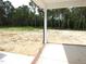 Backyard view from partially shaded concrete patio at 788 Shade Tree Rd, Benson, NC 27504