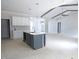 Spacious kitchen with center island, stylish pendant lights, and open floor plan at 788 Shade Tree Rd, Benson, NC 27504