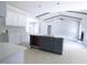 Kitchen with white cabinetry, island, and modern finishes, creating an inviting space at 788 Shade Tree Rd, Benson, NC 27504