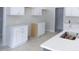 Kitchen with white cabinets, quartz countertops, and stainless steel sink at 788 Shade Tree Rd, Benson, NC 27504