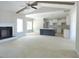 Large living area open to kitchen with fireplace and beamed ceiling at 788 Shade Tree Rd, Benson, NC 27504