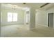 Bright living room featuring decorative molding, large window and chandelier at 788 Shade Tree Rd, Benson, NC 27504