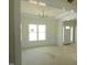 Bright living room features decorative molding, large window and chandelier at 788 Shade Tree Rd, Benson, NC 27504