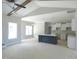 Living room with open floorplan to kitchen features a ceiling fan and multiple windows at 788 Shade Tree Rd, Benson, NC 27504