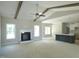 Spacious living room featuring vaulted ceilings, a fireplace and open layout to kitchen at 788 Shade Tree Rd, Benson, NC 27504