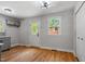 Bright, open kitchen featuring hardwood floors and a view into the dining area at 833 Brigham Rd, Raleigh, NC 27610