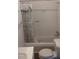 Bathroom featuring a shower with shower curtain, toilet, and sink at 836 S Main St, Roxboro, NC 27573