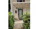 Home entrance features a decorative glass front door and manicured bushes at 836 S Main St, Roxboro, NC 27573