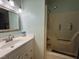 Clean and well-lit bathroom featuring a walk-in shower and vanity sink at 8405 Falcon Crest Cir, Angier, NC 27501