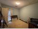 Cozy bedroom with a large window and soft carpet, ready for personalization at 8405 Falcon Crest Cir, Angier, NC 27501