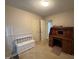 Versatile room with wooden desk and ample storage, suitable for an office or bedroom at 8405 Falcon Crest Cir, Angier, NC 27501