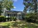Charming single-story home featuring a cozy entrance and a well-manicured lawn at 8405 Falcon Crest Cir, Angier, NC 27501