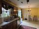 Functional kitchen area with ample storage and a sink overlooking the backyard scenery at 8405 Falcon Crest Cir, Angier, NC 27501