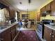 Functional kitchen open to dining area, featuring lots of cabinets and natural light at 8405 Falcon Crest Cir, Angier, NC 27501