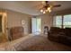 Open living room with neutral walls, patterned rug, and a view towards the entrance at 8405 Falcon Crest Cir, Angier, NC 27501