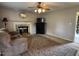 Living room with fireplace, classic rug, and comfortable seating for relaxing at home at 8405 Falcon Crest Cir, Angier, NC 27501