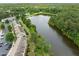 Aerial view of townhomes near a tranquil lake and lush greenery, offering scenic views and natural beauty at 100 Stratford Lakes Dr # 270, Durham, NC 27713