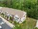 Aerial view of townhomes showcasing lush landscaping, private parking, and well-maintained exteriors at 100 Stratford Lakes Dr # 270, Durham, NC 27713