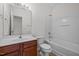 Bathroom features a tub shower, matching vanity and mirror at 100 Stratford Lakes Dr # 270, Durham, NC 27713