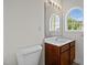 Bathroom featuring a white vanity with a dark wood cabinet and a large mirror at 100 Stratford Lakes Dr # 270, Durham, NC 27713