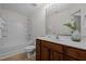 Bathroom featuring a tub with shower and vanity with neutral countertops at 100 Stratford Lakes Dr # 270, Durham, NC 27713