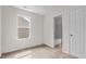 Carpeted bedroom with bright natural light and ensuite access to a full bath at 100 Stratford Lakes Dr # 270, Durham, NC 27713