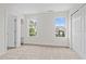 Carpeted bedroom with natural light and a closet for storage at 100 Stratford Lakes Dr # 270, Durham, NC 27713