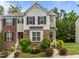 Charming townhome with stone accents, manicured landscaping, and inviting curb appeal at 100 Stratford Lakes Dr # 270, Durham, NC 27713