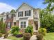 Charming townhome with stone accents, manicured landscaping, and inviting curb appeal at 100 Stratford Lakes Dr # 270, Durham, NC 27713