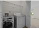 Laundry room featuring white appliances and a wire shelf at 100 Stratford Lakes Dr # 270, Durham, NC 27713