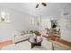 Cozy living room featuring neutral decor, a plush sofa, wooden floors and plenty of natural light at 100 Stratford Lakes Dr # 270, Durham, NC 27713