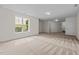 Neutral colored carpet in this bonus room with single window and recessed lighting at 100 Stratford Lakes Dr # 270, Durham, NC 27713