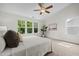 Bright main bedroom features three windows and natural light at 100 Stratford Lakes Dr # 270, Durham, NC 27713