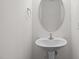 Clean, minimalist powder room featuring a modern sink and mirror at 100 Stratford Lakes Dr # 270, Durham, NC 27713