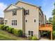 Rear view showing vinyl siding and deck area with greenery, offering a peaceful outdoor space at 100 Stratford Lakes Dr # 270, Durham, NC 27713
