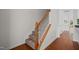 Carpeted staircase with wooden railings and white spindles at 100 Stratford Lakes Dr # 270, Durham, NC 27713