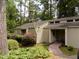 Charming home with a welcoming entrance and lush landscaping in a secluded, wooded setting at 101 Solway Ct, Cary, NC 27511