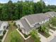 An aerial view of multi-Gathering home with manicured landscaping and tree-lined streets at 1020 Kingston Grove Dr, Cary, NC 27519