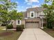 Charming two-story townhome with a brick-front and a two-car garage at 1020 Kingston Grove Dr, Cary, NC 27519