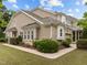 Exterior of two-story home with brick and vinyl siding, well-maintained landscaping at 1020 Kingston Grove Dr, Cary, NC 27519