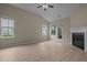The living room offers wood-look floors, a fireplace, and a ceiling fan at 1020 Kingston Grove Dr, Cary, NC 27519
