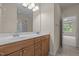 Vanity area of the main bathroom with dual sinks and a large mirror at 1020 Kingston Grove Dr, Cary, NC 27519