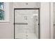 Bathroom featuring a beautifully tiled shower with a glass door and modern fixtures at 103 Lakeway Ct, Cary, NC 27511