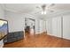 This bedroom has hardwood floors, ceiling fan, access to other living spaces, and a large closet at 103 Lakeway Ct, Cary, NC 27511