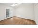 This sunny bedroom includes laminate flooring, access to a patio, skylights, and a closet at 103 Lakeway Ct, Cary, NC 27511