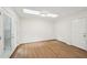 This sunny bedroom includes laminate flooring, access to a patio, skylights, and a closet at 103 Lakeway Ct, Cary, NC 27511