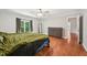 Bedroom features hardwood floors, a ceiling fan and a large window for ample natural light at 103 Lakeway Ct, Cary, NC 27511