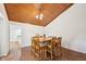 Bright dining room with vaulted wood ceiling and a table for six at 103 Lakeway Ct, Cary, NC 27511