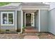 Welcoming front entrance features a decorative door and brick walkway at 103 Lakeway Ct, Cary, NC 27511